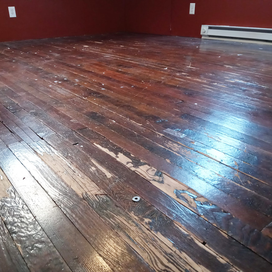 rough looking pine floor in New Jersey attic