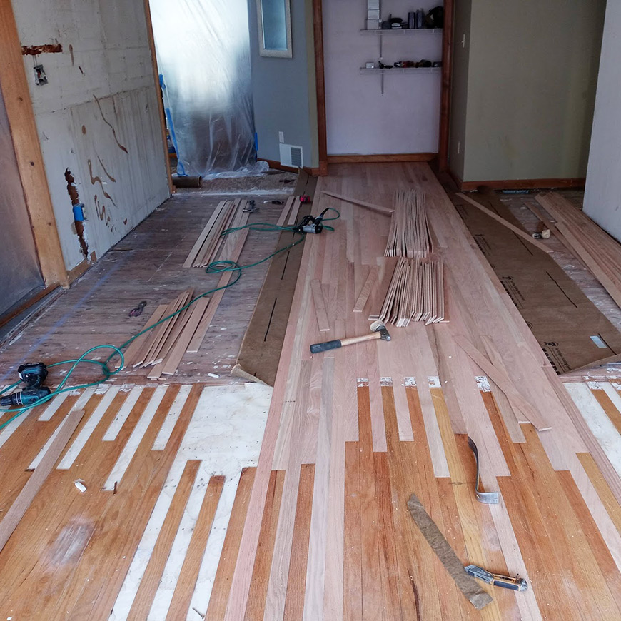 weaving new floor into old oak